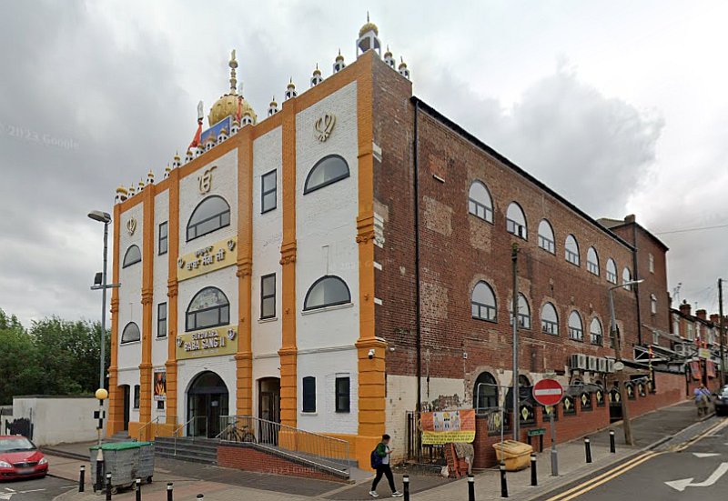 A Google StreetView Image showing the former Empire Theatre, Smethwick in June 2023, now heavily altered for its use as the Gurdwara Baba Sang Ji Sikh Temple - Click to Interact.