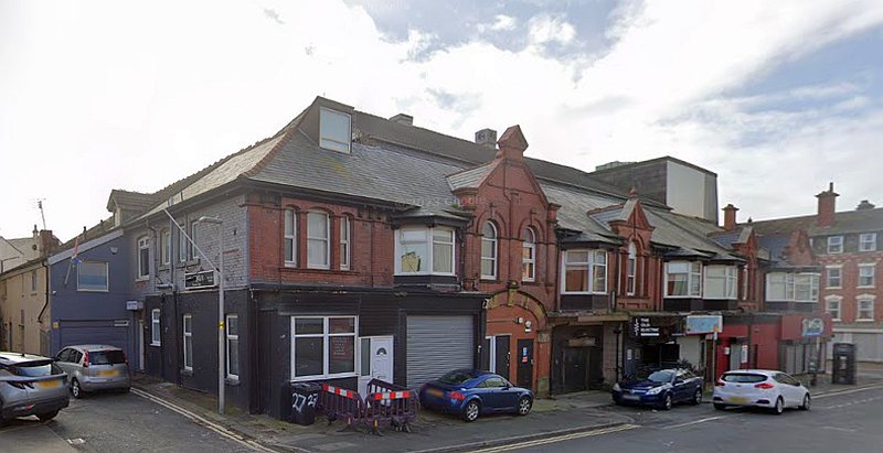 A Google StreetView Image showing the side and rear elevations of the former Princess Electric Theatre, Blackpool, and current entrance to 'The Old Electric' on Springfield Road in March 2023 - Click to Interact. 