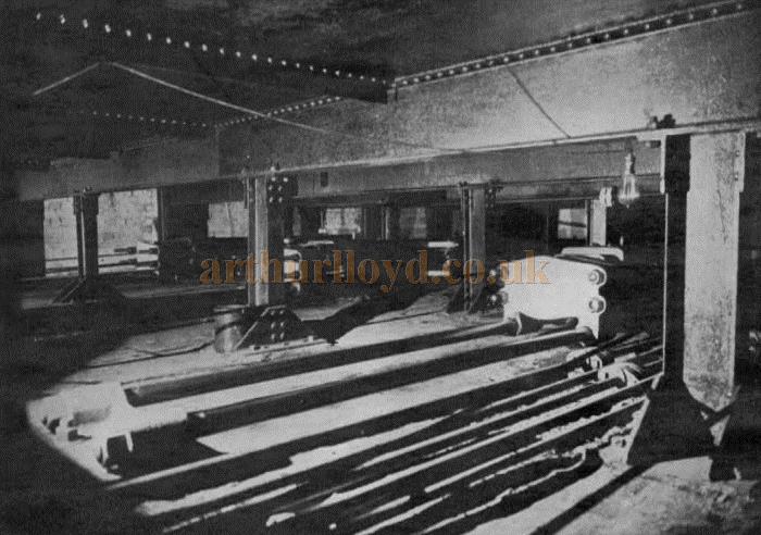 Under the main water tank, showing three of the four hydraulic rams for operating the tank tables.