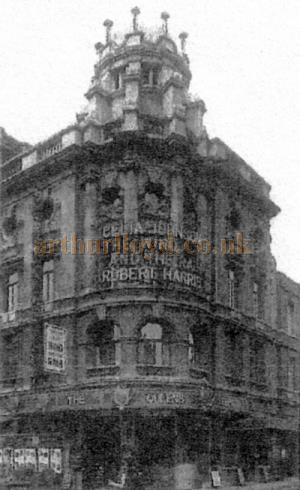 A photograph showing the original facade of the Queen's Theatre circa 1937 - From a 2003 Delfont Macintosh Press Handout.