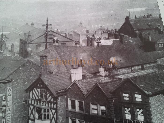 This photo shows the roof of the Alexandra Hall and how it was tucked in behind buildings fronting Market place - With kind permission Wigan Reference Library.